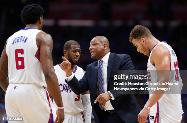 Los Angeles Clippers head coach Doc Rivers works with center DeAndre Jordan , guard Chris Paul and forward Blake Griffin during a time out against...