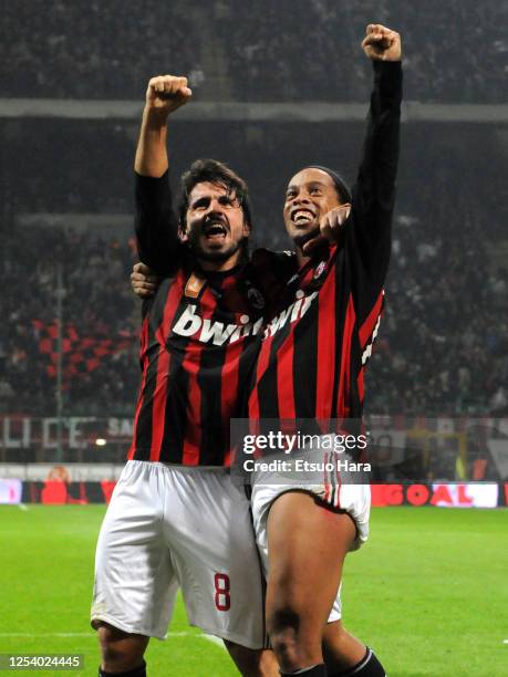 Ronaldinho of AC Milan celebrates scoring the opening goal with his team mate Gennaro Gattuso during the Serie A match between AC Milan and Napoli at...