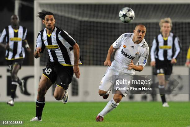 Amauri of Juventus and Fabio Cannavaro of Real Madrid compete for the ball during the UEFA Champions League Group H match between Juventus and Real...