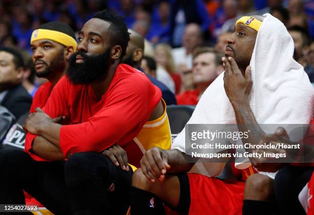 Houston Rockets forward Josh Smith , guard James Harden and guard Jason Terry sit on the bench near the end of the fourth quarter against the Los...