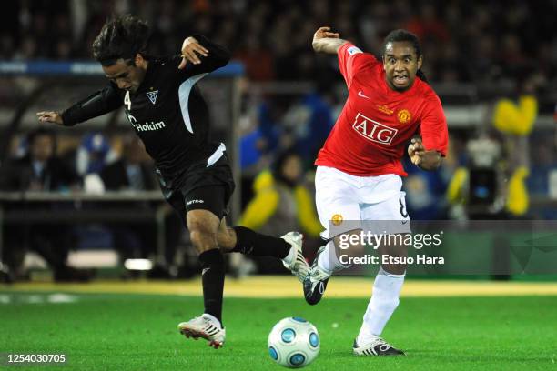 Anderson of Manchester United and Paul Ambrosi of LDU Quito compete for the ball during the FIFA Club World Cup final match between LDU Quito and...