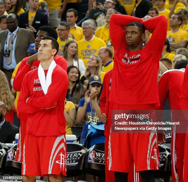 Houston Rockets guard Pablo Prigioni and forward Terrence Jones stand along the bench near the end of the fourth quarter of Game 5 of the NBA Western...