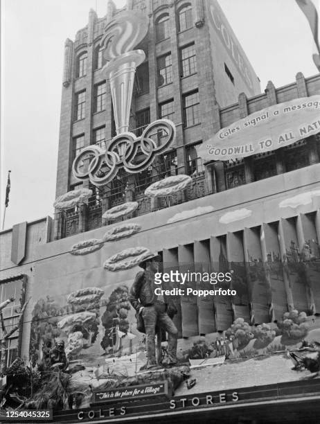 The facade of supermarket Coles Stores celebrates Melbourne hosting the 1956 Summer Olympics, with the Olympic torch above the Olympic rings a...