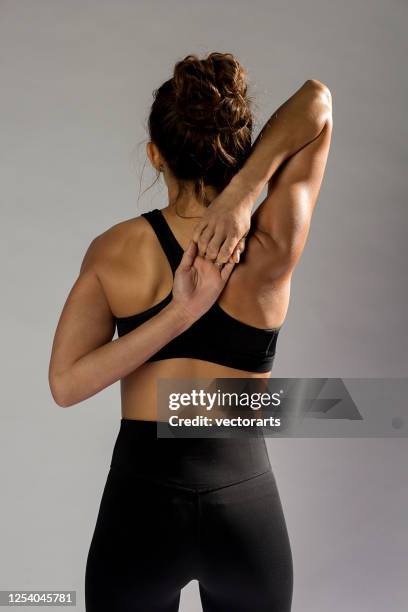 yoga back stretch - deltoid stock pictures, royalty-free photos & images