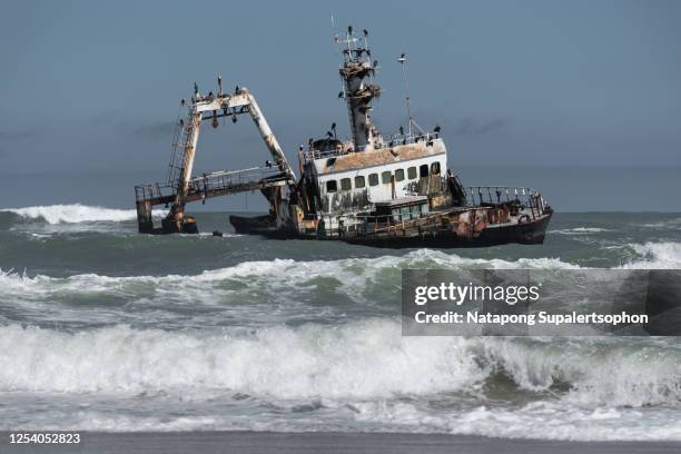 wrecked ship at skeleton coast, namibia. - headland stock pictures, royalty-free photos & images