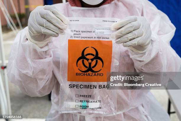 covid-19 specimen bag - biohazard symbol stockfoto's en -beelden