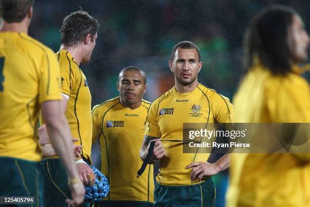 Will Genia and Quade Cooper of the Wallabies look on dejected adter the final whistle during the IRB 2011 Rugby World Cup Pool C match between...