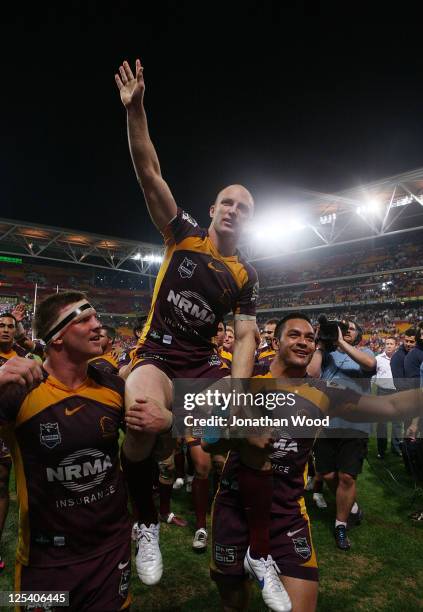 Darren Lockyer of the Broncos is carried from the field by team mates after the NRL second semi final match between the Brisbane Broncos and the St...