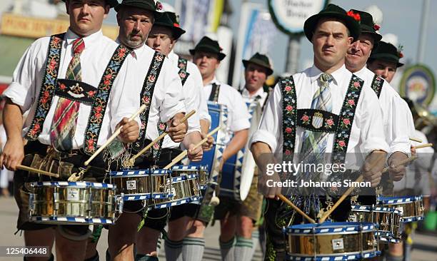 Traditionally Bavarian dressed members of a drummer group arrive for the opening day of the Oktoberfest 2011 beer festival at Theresienwiese on...