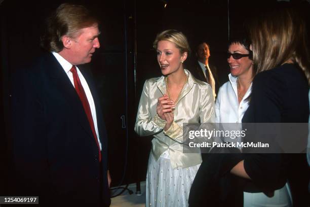 View of, from left, American real estate developer Donald Trump, model and heiress Paris Hilton, and British socialite Ghislaine Maxwell as they talk...