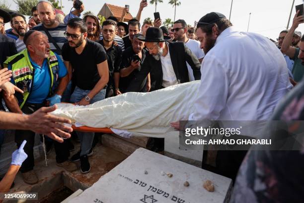 Mourners take part in the funeral of Israeli-Tunisian Aviel Haddad killed on May 9 in a mass shooting in the Tunisian island of Djerba, in the...