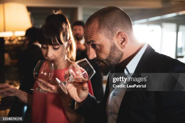 couple at the counter enjoying nightlife - cognac brandy stock pictures, royalty-free photos & images