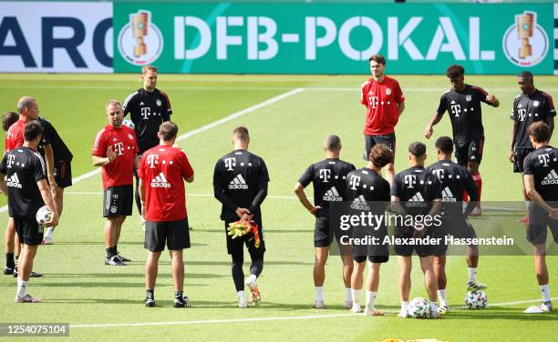 Hnas-Dieter Flick, head coach of Bayern Muenchen talks to his players during a FC Bayern Muenchen training session ahead of DFB Cup 2020 final match...