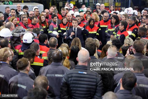 French President Emmanuel Macron delivers remarks to employees as he visits the Aluminium Dunkerque factory in Dunkirk, the city picked by Taiwanese...