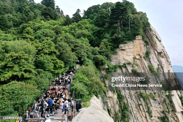 Members of Xi'an Symphony Orchestra take part in a concert rehearsal on Huashan Mountain on July 3, 2020 in Weinan, Shaanxi Province of China.