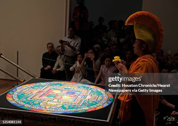 Geshe, Lobsang Rabjor during a ceremony by Tibetan Buddhist monks from Drepung Loseling Monastery to sweep away a mandala sand painting after...