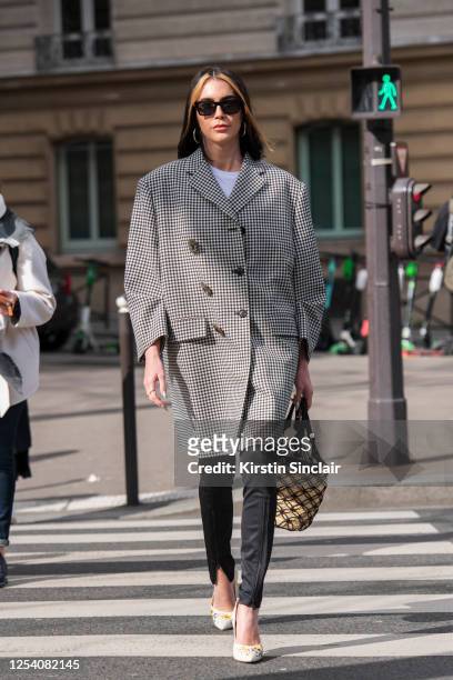 Digital influencer Brittany Xavier wears all Miu Miu on March 03, 2020 in Paris, France.