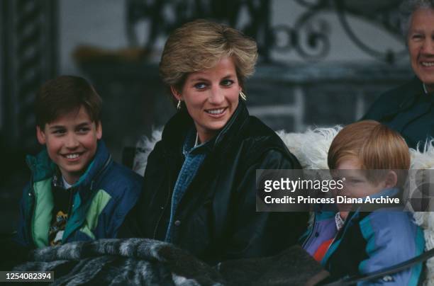 Diana, Princess of Wales riding in a traditional sleigh with Prince William and Prince Harry during a skiing holiday in Lech, Austria, 30th March...