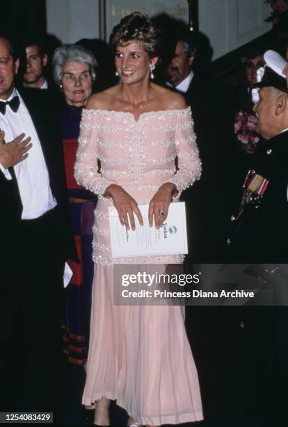 Diana, Princess of Wales visits the Savoy Theatre in London for its official reopening after its restoration, 19th July 1993. Her pink silk dress...