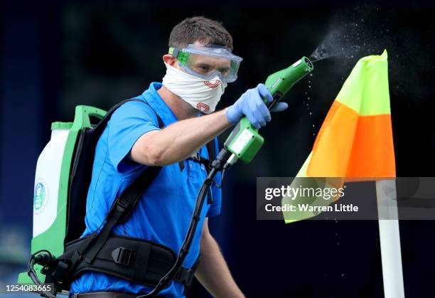 The corner flags are disinfected before the Sky Bet League One Play Off Semi-final 1st Leg match between Portsmouth FC and Oxford United at Fratton...