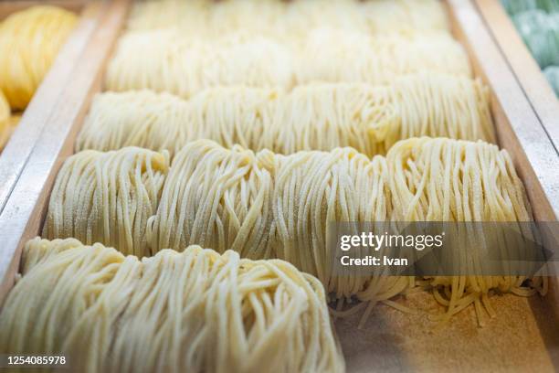 group of handmade raw japanese ramen noodle - udon noodle stock pictures, royalty-free photos & images