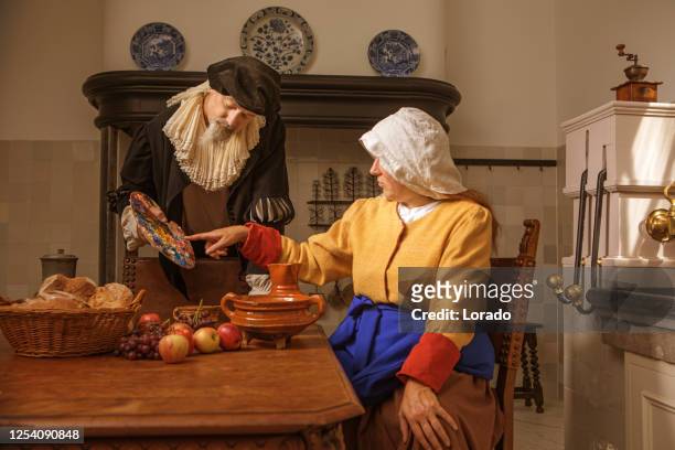 portret van een mooie historische nederlandse melkmeisje en een edelman - historische kleding stockfoto's en -beelden