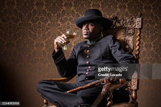 african traditionally dressed european man with a weapon - renaissance stock pictures, royalty-free photos & images