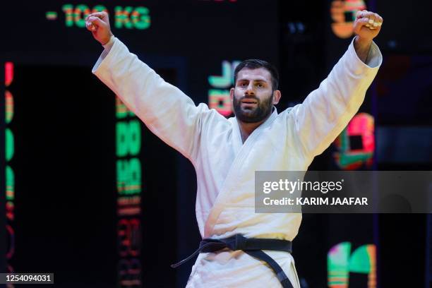 Russia's Arman Adamian celebrates after defeating Czech Republic's Lukas Krpalek in their men's -100Kg final bout at the World Judo Championship in...