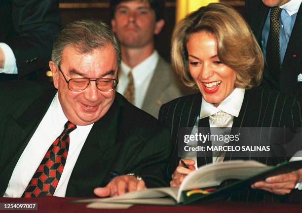 Maria Emma Mejia , the foreign minister of Colombia, and Russian Foreign Minister Yevgeny Primakov laugh during the signing of anti-mafia agreements...