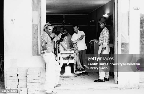 Barbershop, Pinalito after mudslide, Cuba, Santiago de Cuba , Pinalito , 1963. From the Deena Stryker photographs collection.