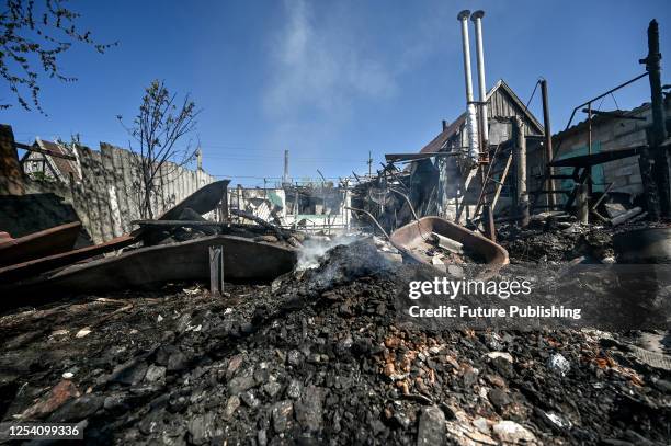 The fire-stricken premises of a house destroyed in the Russian MLRS attack are seen in Malokaterynivka, Zaporizhzhia Region, southeastern Ukraine. As...