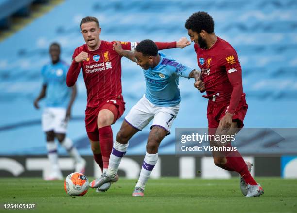 Raheem Sterling of Manchester City in action with Jordan Henderson and Joe Gomez of Liverpool during the Premier League match between Manchester City...