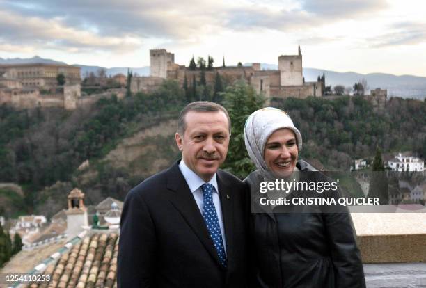 Turkish Prime Minister Recep Tayyip Erdogan poses with his wife Ermine Erdogan, 13 January 2008 during a visit to the 'La Alhambra' in Granada, that...