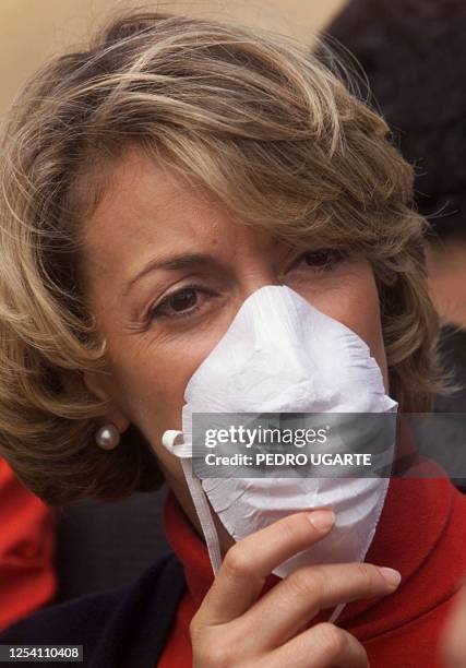 Liberal Party vice presidential candidate and former Colombian Foreign Minister Maria Emma Mejia wears a filter mask at a Bogota city dump, 24 May,...