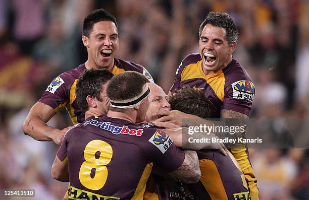 Darren Lockyer of the Broncos celebrates victory after kicking the winning field goal in gold point extra time during the NRL second semi final match...