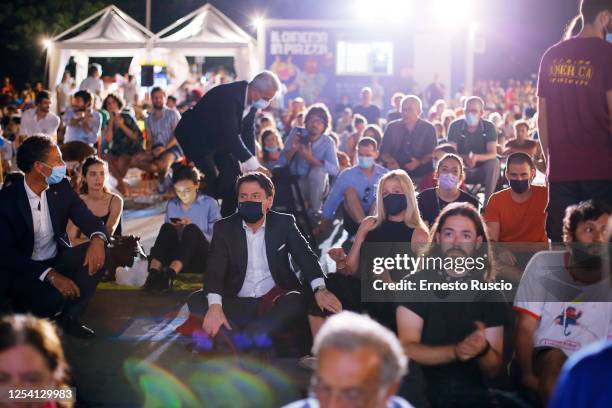 Italian Prime Minister Giuseppe Conte and Olivia Palladino attend the Summer Opening of Cinema America at Piazza San Cosimato on July 03, 2020 in...