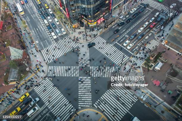 tokyo aerial photograph busy pedestrian crossing ginza shopping district japan - capitalism stock pictures, royalty-free photos & images