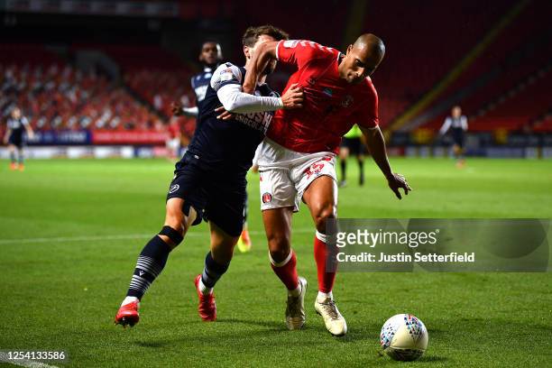 Tom Bradshaw of Millwall and Darren Pratley of Charlton Athletic battle for possession during the Sky Bet Championship match between Charlton...