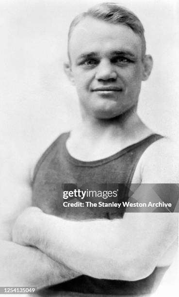 Bantamweight professional boxer Kid Williams of the United States poses for a portrait circa 1910.