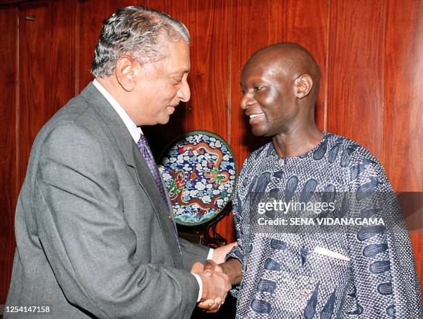 Olara Otunnu, the Ugandan diplomat who is the special representative of the UN SEcretary General on Children and armed conflict , shakes hands 04 May...