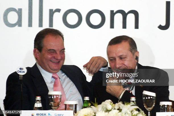 Greek Prime Minister Costas Karamanlis chats with his Turkish counterpart Recep Tayyip Erdogan during a meeting at Bilkent University in Istanbul 25...