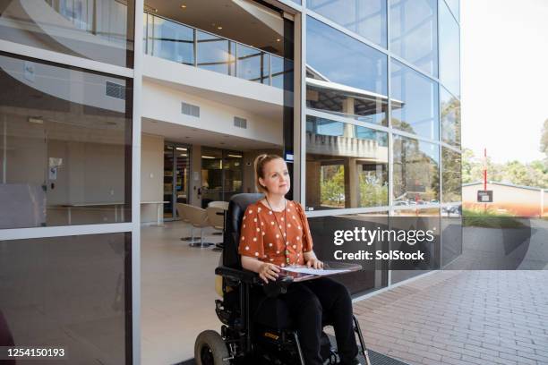 heading out for a errand - motorized wheelchair stock pictures, royalty-free photos & images