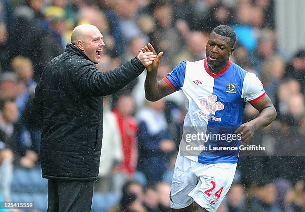 Steve Keane of Blackburn Rovers congratulates Yakubu on scoring the third goal during the Barclays Premier League match between Blackburn Rovers and...