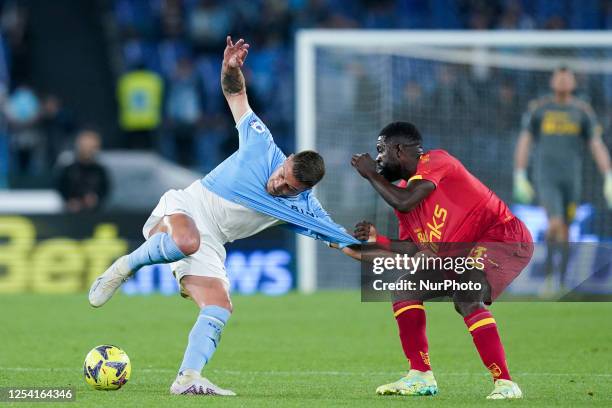 Samuel Umtiti of US Lecce and Sergej Milinkovic-Savic of SS Lazio compete for the ball during the Serie A match between SS Lazio and US Lecce at...