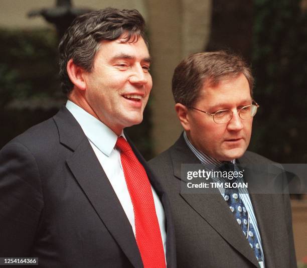 Britain's Chancellor of the Exchequer Gordon Brown and German Director General of the Finance Ministry Klaus Regling stand together during the Group...