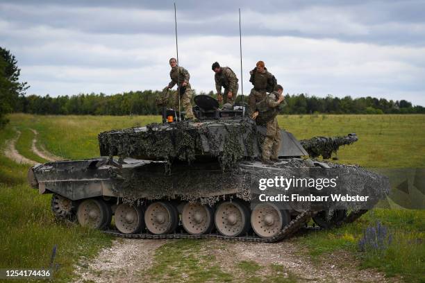 Female commander, left, and crew of a Challenger 2 Main Battle Tank during a training exercise on Salisbury Plain Training Area on July 03, 2020 in...