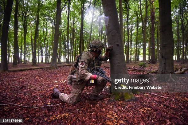 Soldiers attack enemy positions in woodland during a training exercise on Salisbury Plain Training Area on July 03, 2020 in Salisbury, England. 5...