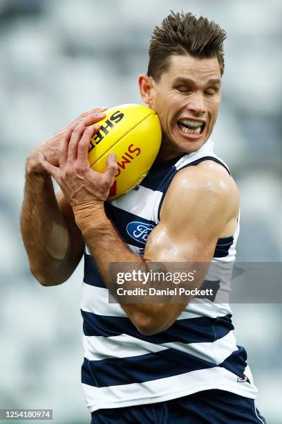 Tom Hawkins of the Cats marks the ball during the round 5 AFL match between the Geelong Cats and the Gold Coast Suns at GMHBA Stadium on July 04,...