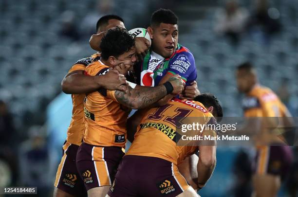 David Fusitu'a of the Warriors is tackled by Issac Luke of the Broncos during the round eight NRL match between the New Zealand Warriors and the...