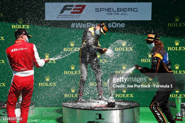 Race winner Oscar Piastri of Australia and Prema Racing , second placed Logan Sargeant of United States and Prema Racing and third placed Alex Peroni...